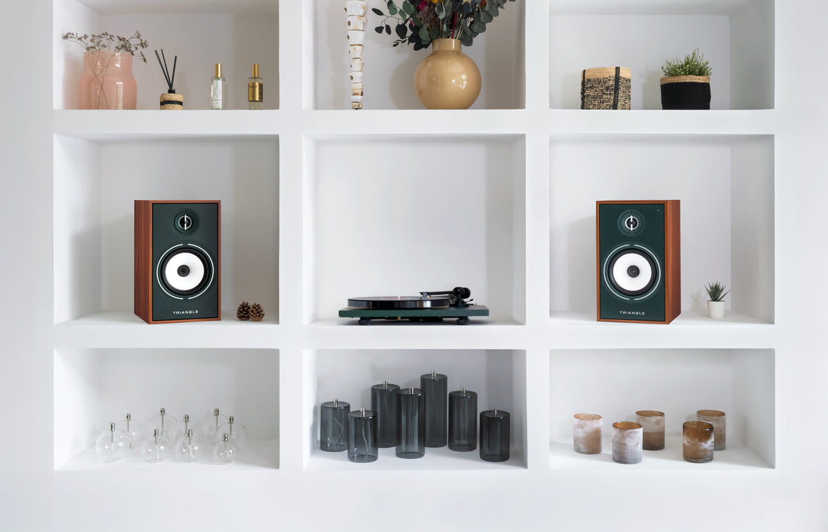 Borea speakers and a turntable in a white bookcase